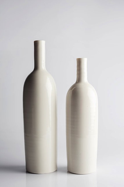 Appraisal: Gilda Westermann German b Two bottle vaseswhite glazeimpressed potter's mark