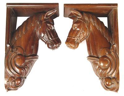 Appraisal: Two carved wood wall brackets carved as horses heads in