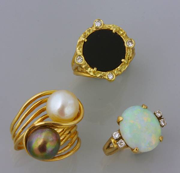 Appraisal: A collection of three gold rings one twin cultured pearl