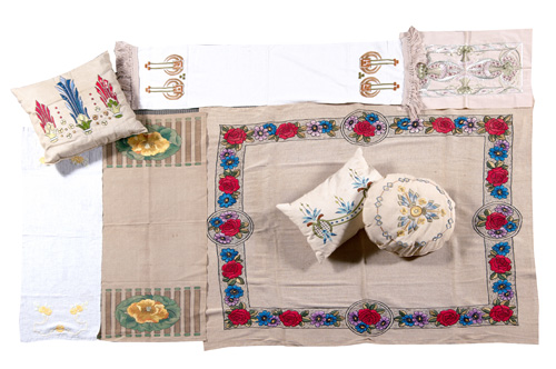 Appraisal: TEXTILES Eight embroidered linens including three pillows one rectangular table