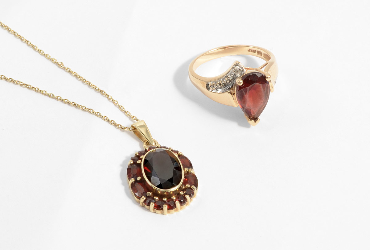 Appraisal: CTW GARNET RING PENDANT K yellow gold ring contains one