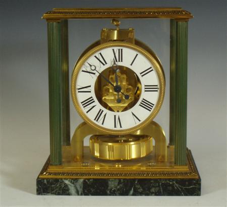 Appraisal: A Jaeger Le Coultre Atmos clock the white enamel chapter