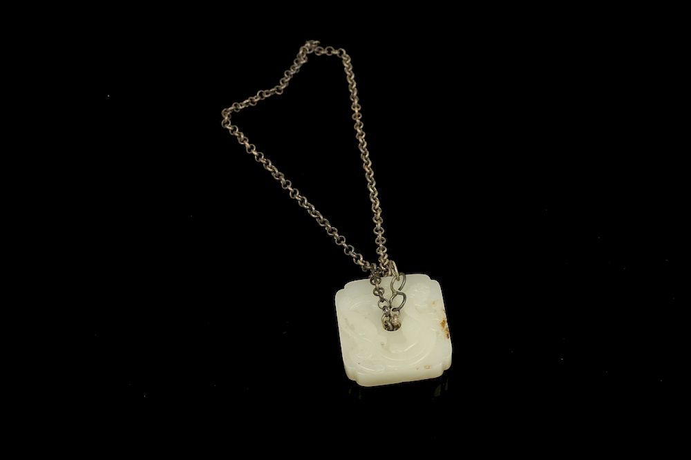 Appraisal: CHINESE CARVED JADE 'DRAGON' PENDANT Of a rectangular section with