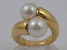 Appraisal: Cartier an carat gold cultured pearl crossover ring each pearl