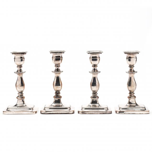 Appraisal: A SET OF FOUR ENGLISH SILVERPLATE CANDLESTICKS Circa unmarked silver