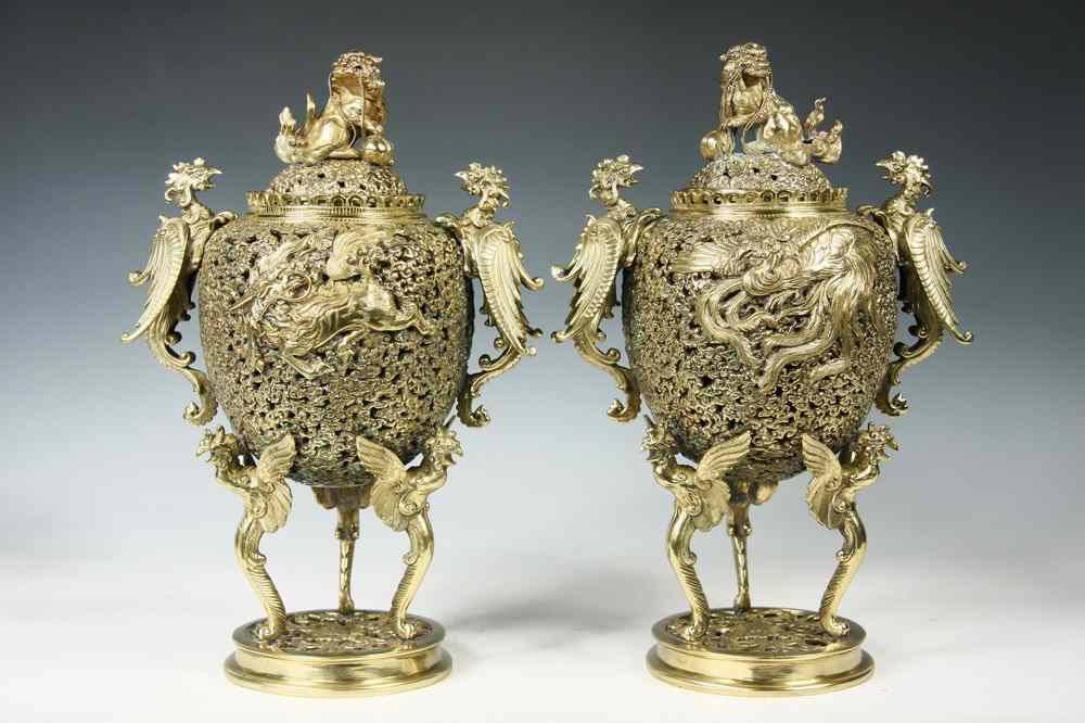 Appraisal: INCENSE BURNERS - Pair of Chinese cast reticulated and chased