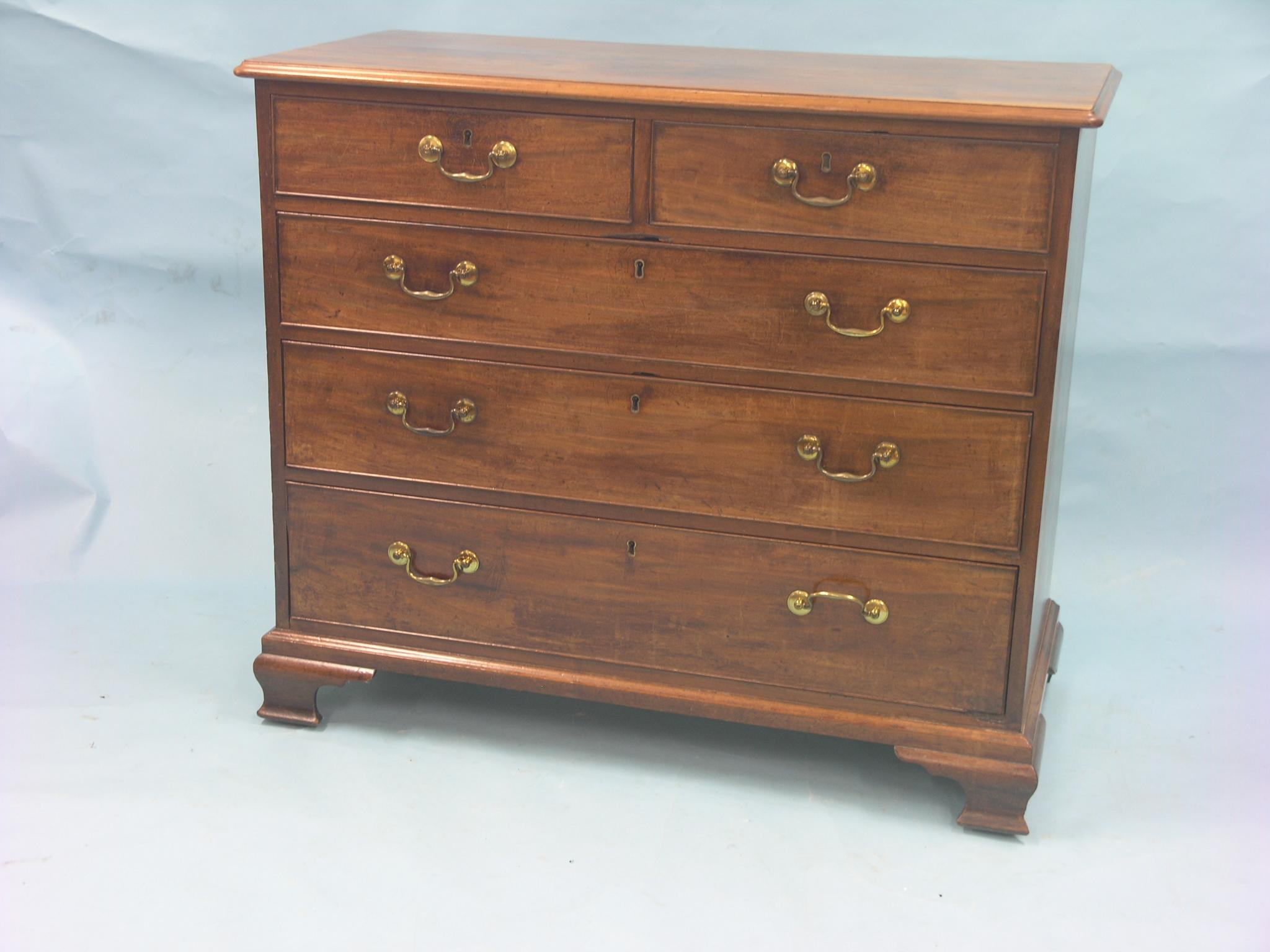 Appraisal: A George III mahogany chest two short and three long