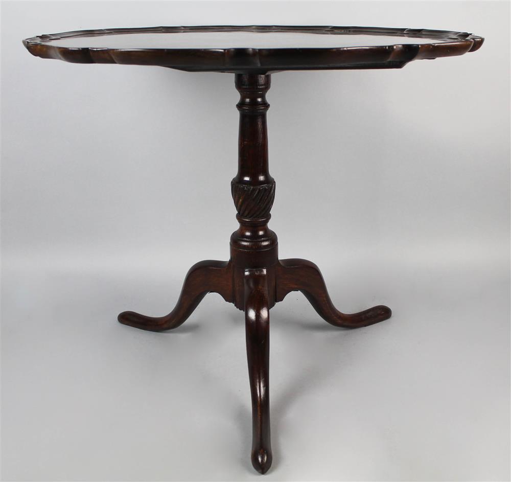 Appraisal: GEORGIAN STYLE MAHOGANY PIE CRUST TEA TABLE having a round