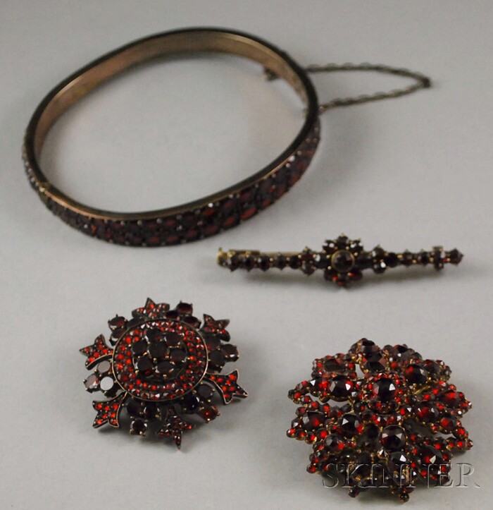 Appraisal: Four Antique Garnet Jewelry Items a hinged silver bangle bracelet