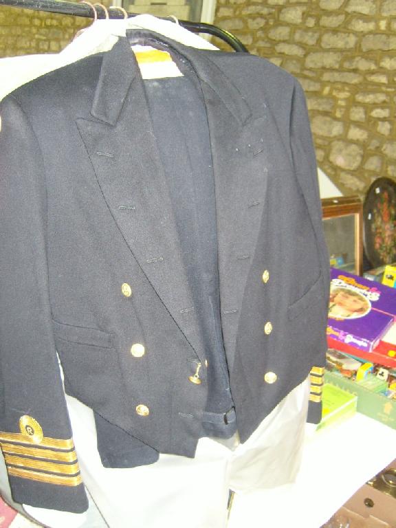 Appraisal: A collection of four Naval Officers uniforms including dress uniforms