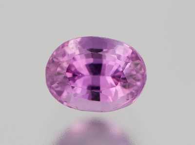 Appraisal: An Unmounted Fancy Pink Sapphire Carat Oval faceted cut weighting