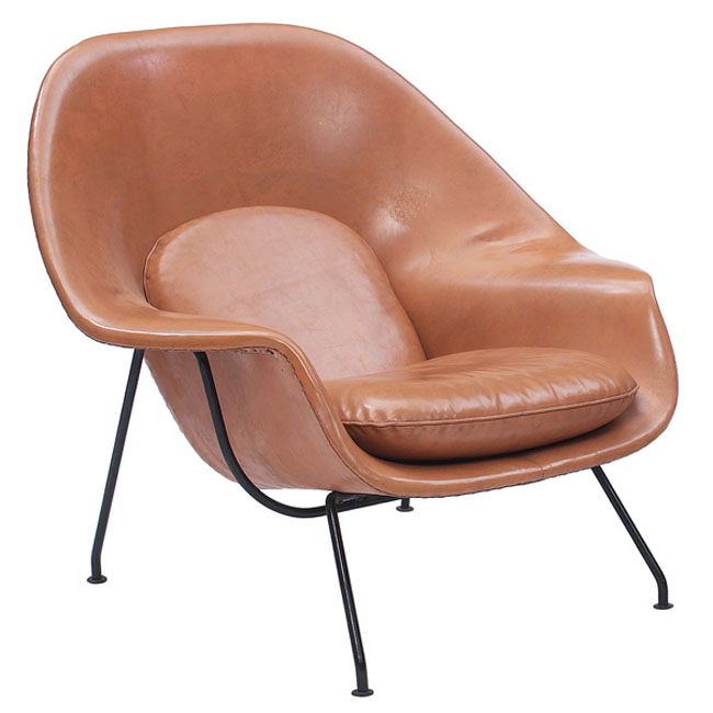 Appraisal: Eero Saarinen Womb chair by tan vinyl upholstery over black