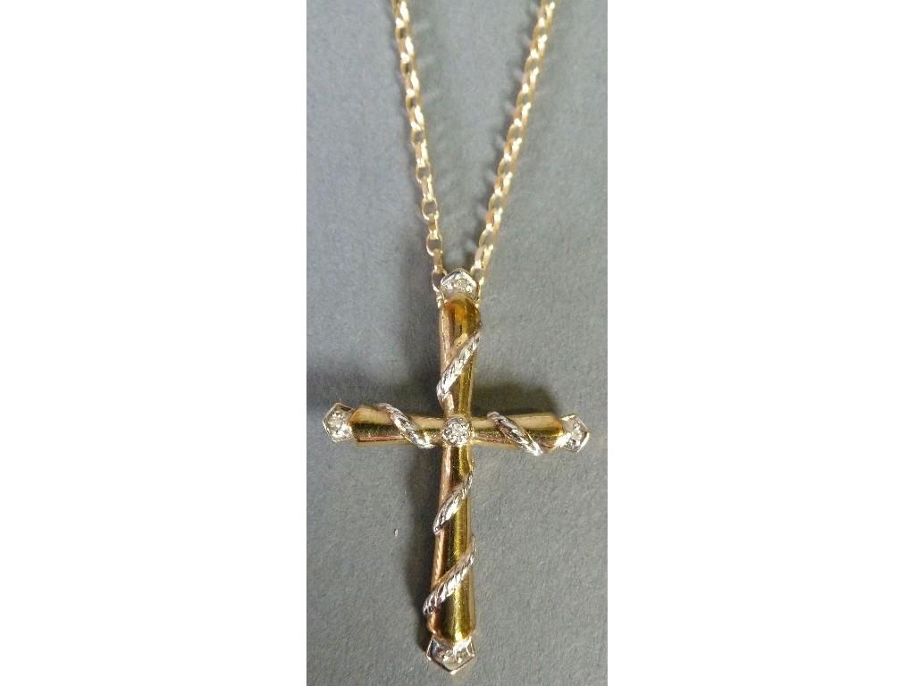 Appraisal: ct GOLD CROSS PENDANT set with a tiny diamond on