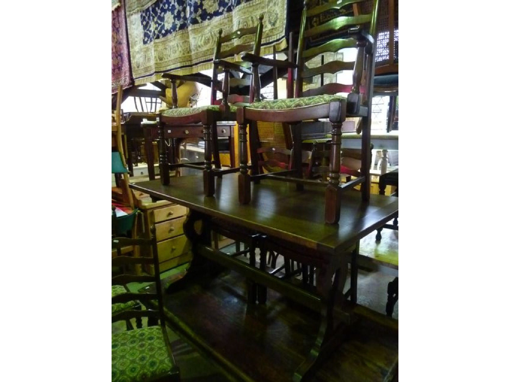 Appraisal: A reproduction oak refectory table the rectangular top raised on