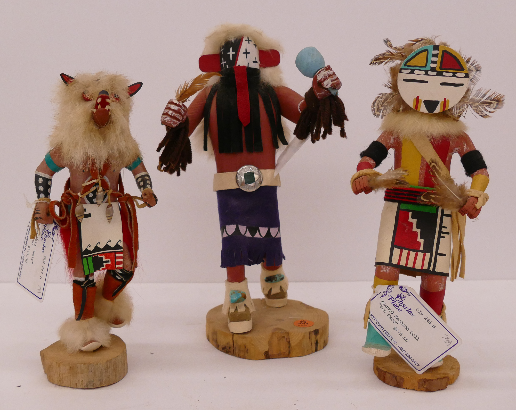 Appraisal: pc Small SW Kachina Dolls- warrior wolf and sun face-