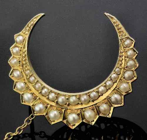 Appraisal: A late Victorian ct gold mounted seed pearl set crescent