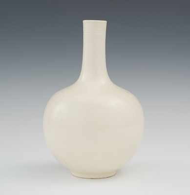 Appraisal: A Bottle Vase with Cream Glaze Bottle shaped vase of