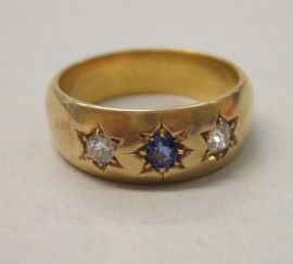 Appraisal: A gold sapphire and diamond set three stone ring star