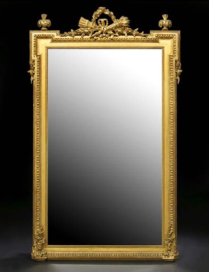 Appraisal: Empire-Style Giltwood Looking Glass mid- th century the beveled rectangular