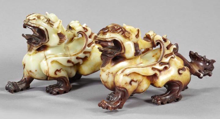 Appraisal: Pair of Fanciful Chinese Carved Celadon Jade Figures second quarter