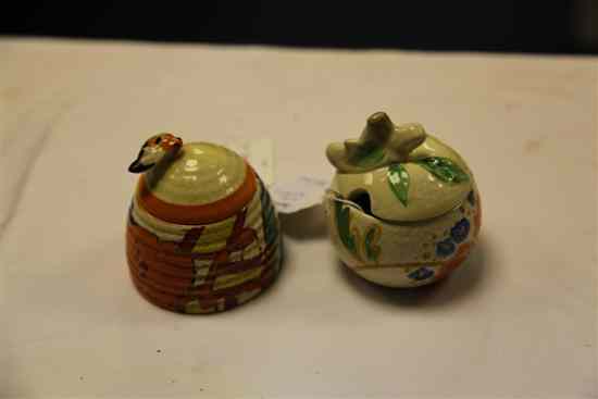 Appraisal: Two Clarice Cliff preserve pots and covers in 'Bobbins' pattern