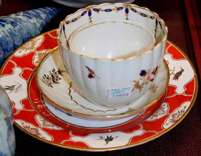 Appraisal: A WORCESTER TEA BOWL AND SAUCER of spiral fluted form