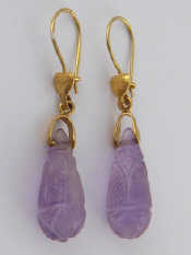 Appraisal: A pair of yellow metal tests carat gold carved amethyst