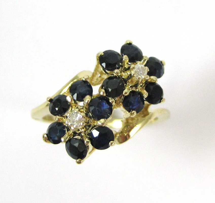 Appraisal: SAPPHIRE DIAMOND AND FOURTEEN KARAT GOLD RING The yellow gold