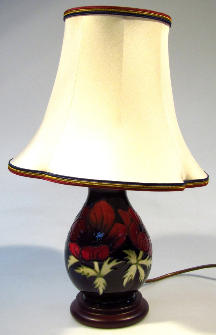 Appraisal: A Moorcroft Anemone pattern lamp of bulbous circular form with