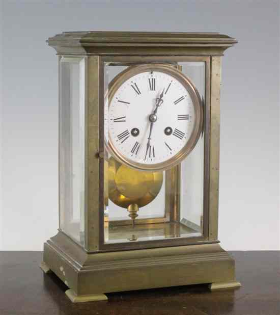 Appraisal: An Edwardian brass four glass mantel clock with enamelled Roman