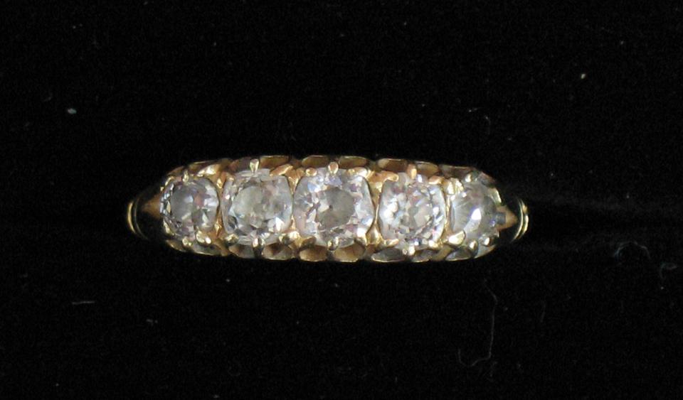 Appraisal: A VICTORIAN FIVE STONE DIAMOND RING the graduated round old-cut