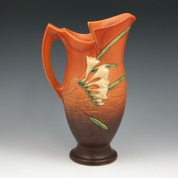 Appraisal: Roseville Freesia pitcher in brown Marked Roseville USA - Mint