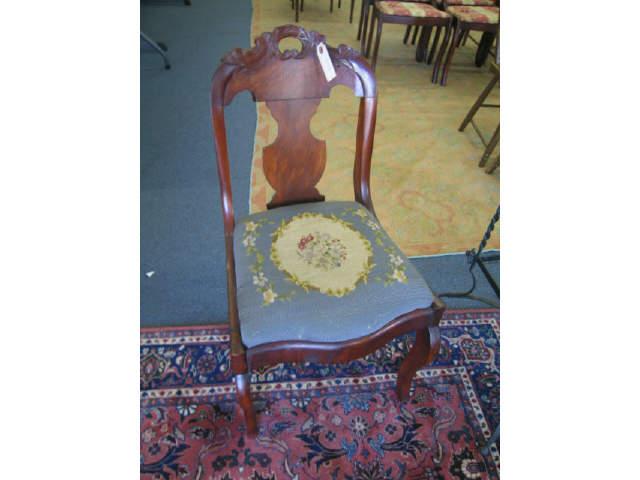 Appraisal: Victorian Carved Mahogany Side Chair floral needlepoint seat