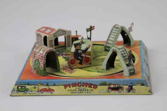 Appraisal: MARX PINCHED TABLE TOY Lithographed tin features auto circling truck