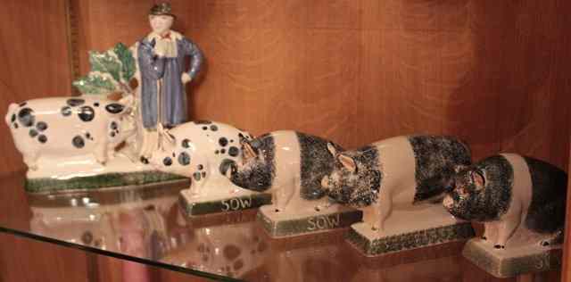 Appraisal: A RYE POTTERY TIN GLAZED MODEL of a pig farmer