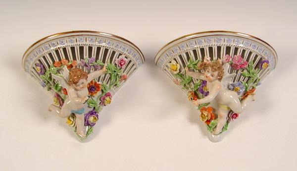 Appraisal: PAIR CARL THIEME DRESDEN PORCELAIN WALL BRACKETS Adorned with winged