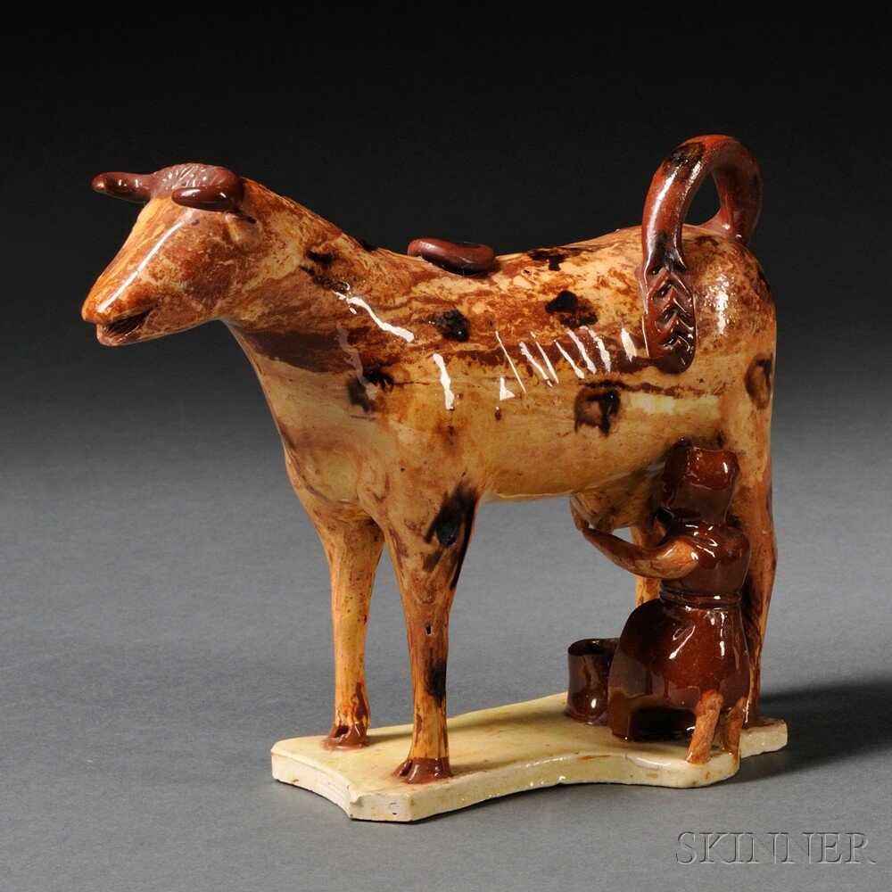 Appraisal: Staffordshire Agate Cow Creamer with Maiden England th century rust