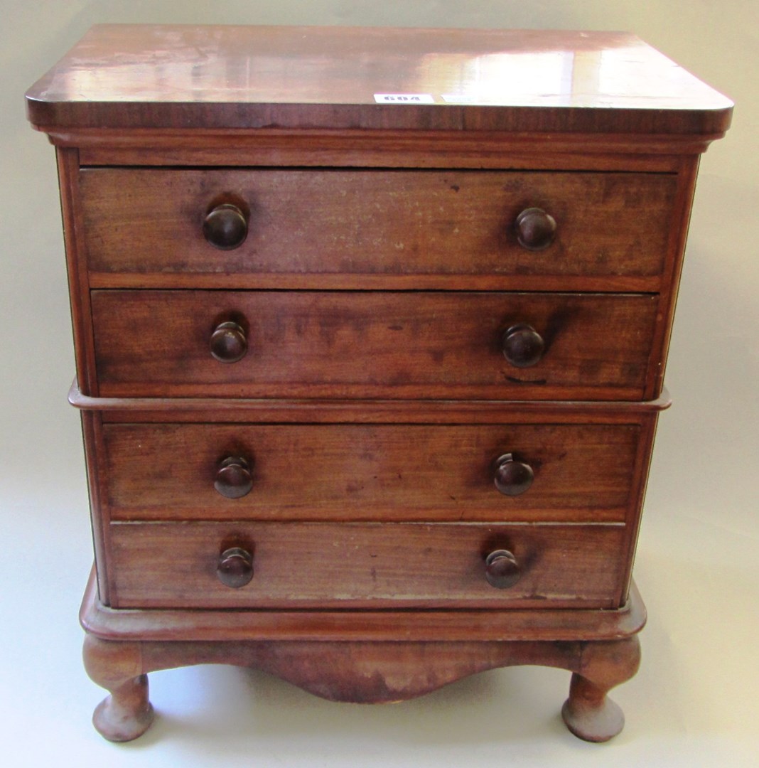 Appraisal: A made up mahogany miniature chest of four long drawers