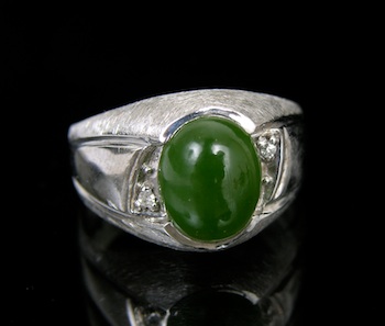 Appraisal: A Jade and Diamond Ring White gold ring with diamond