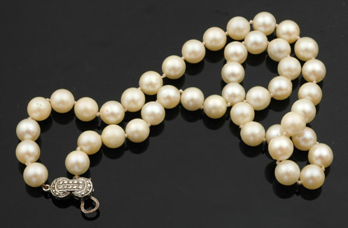 Appraisal: STRAND OF CULTURED PEARLS TO A STERLING SILVER AND MARCASITE