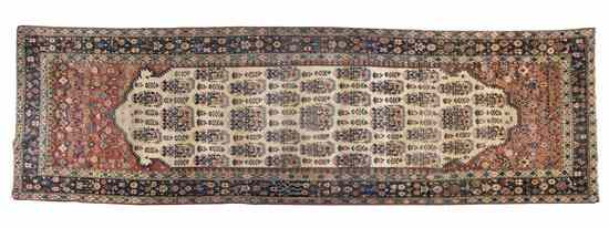 Appraisal: A Persian Wool Runner having repeating flowering plants on an