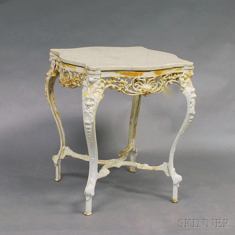 Appraisal: Rococo-style White-painted Cast Iron Marble-top Table the shaped top and