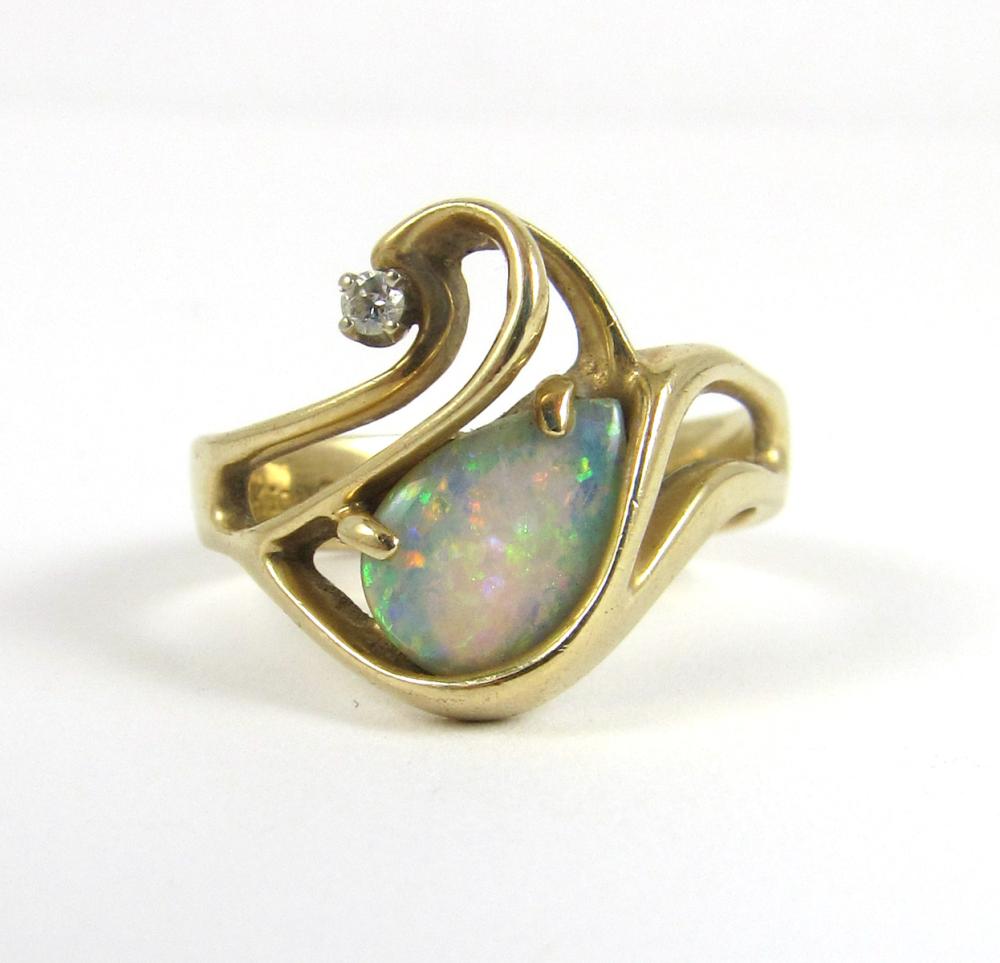 Appraisal: DIAMOND AUSTRALIAN OPAL AND FOURTEEN KARAT GOLD RING set with