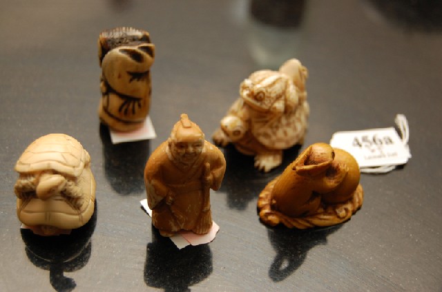 Appraisal: A COLLECTION OF JAPANESE IVORY AND STAGHORN NETSUKE Comprising four