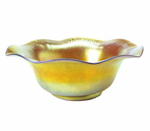 Appraisal: A Steuben gold Aurene glass center bowl with stretched ruffled