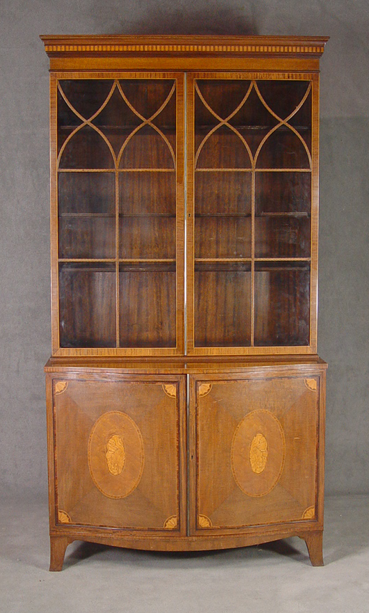 Appraisal: Mahogany Serpentine Breakfront China Cabinet th Century Two piece construction