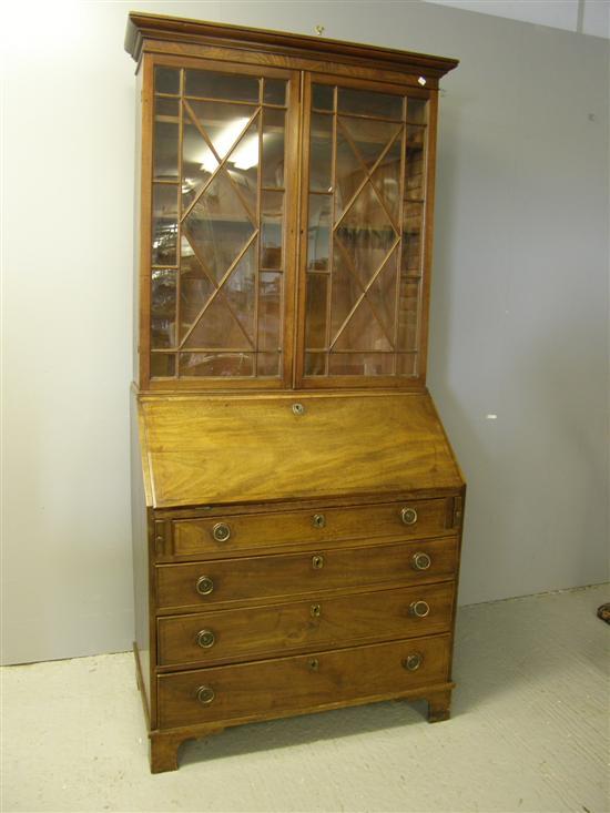 Appraisal: George III mahogany bureau bookcase with astragal glazed top the