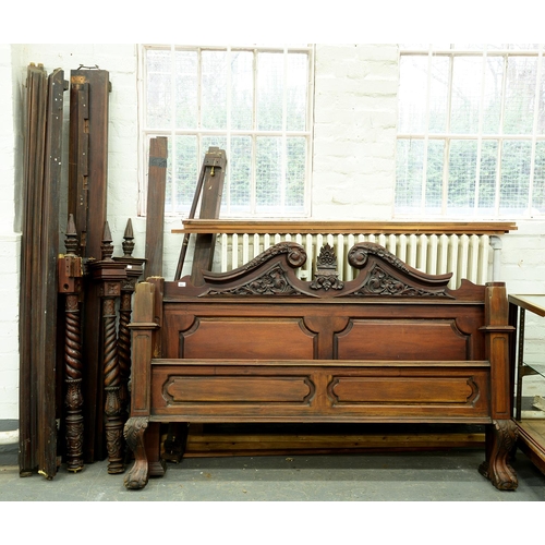 Appraisal: A carved and stained walnut half tester bed with panelled