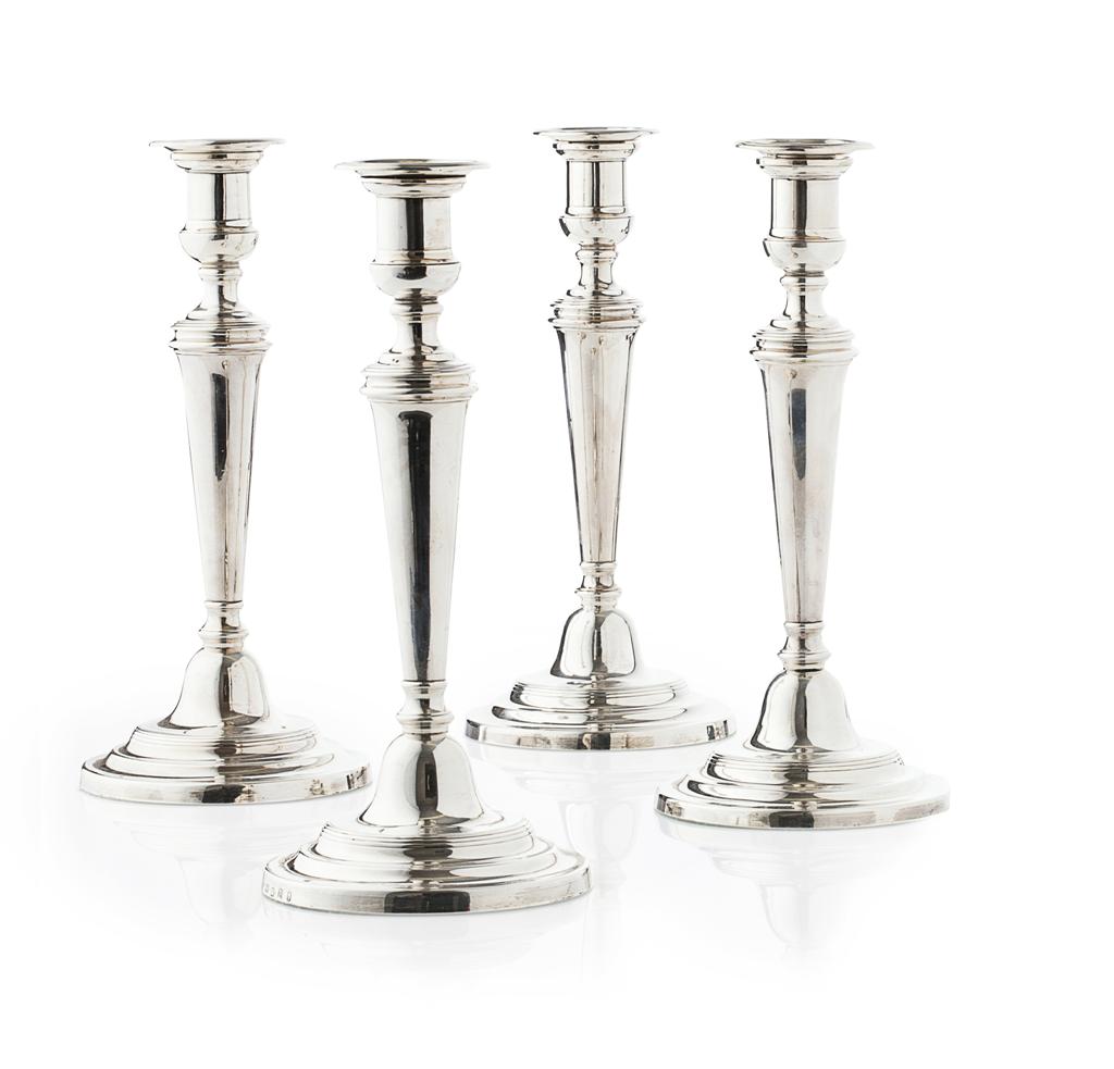 Appraisal: A set of four George III plain silver table candlesticks