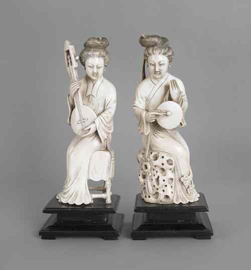 Appraisal: Two Chinese carved ivory figures of woman playing instruments h